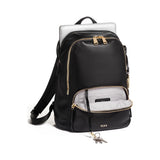 Tumi Voyageur Hannah leather backpack showing sleek black leather exterior with adjustable shoulder straps and front zip pocket.