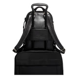 Tumi Voyageur Hannah leather backpack with adjustable straps and multiple compartments, shown from the front.