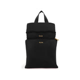 Black Tumi Voyageur Just in Case backpack with gold accents, featuring multiple compartments and a sleek, compact design.