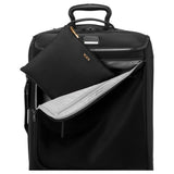 Black Tumi Voyageur Just in Case backpack with gold accents, featuring multiple compartments and adjustable straps.