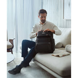 Tumi Alpha Brief Pack backpack with multiple compartments, black nylon fabric, adjustable shoulder straps, and streamlined design.