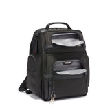 Tumi Alpha Brief Pack backpack shown in black with multiple compartments and padded shoulder straps for comfortable carrying.