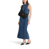 Black Tumi Voyageur Alabama Crossbody Sling with gold accents, featuring adjustable strap and multiple compartments for everyday use.
