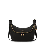 Black Tumi Voyageur Alabama crossbody sling bag with gold accents, compact and stylish for everyday use.