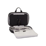 Black Tumi Voyageur Madeline Cosmetic bag with gold accents, compact and stylish for travel essentials.