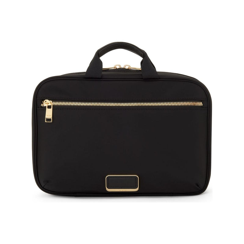 Black Tumi Voyageur Madeline Cosmetic bag with gold accents, featuring multiple compartments and a sleek, compact design.