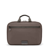 Black Tumi Voyageur Madeline Cosmetic bag with gold accents, featuring multiple compartments and a sleek, compact design.