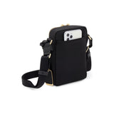 Black Tumi Voyageur Persia Crossbody bag with gold accents, showcasing its sleek design and adjustable strap.