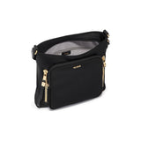 Tumi Voyageur Tyler Crossbody bag in black with adjustable strap and front zipper pocket, stylish travel accessory.