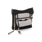Tumi Voyageur Tyler Crossbody bag in black with adjustable strap, featuring multiple compartments and sleek design.