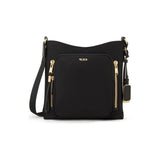 Tumi Voyageur Tyler Crossbody bag with adjustable strap, multiple compartments, and sleek design for travel and everyday use.
