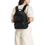 Tumi Voyageur Denver Backpack in black with multiple compartments and padded shoulder straps, designed for travel and daily use.