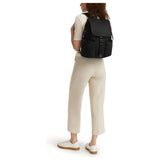 Tumi Voyageur Ramsay Backpack in black with leather accents, showing multiple compartments and adjustable shoulder straps.