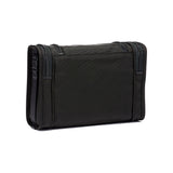 Black Tumi Alpha hanging travel kit with multiple compartments and zippers for organized travel storage.
