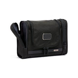 Black Tumi Alpha hanging travel kit with multiple compartments for organized travel essentials.