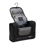 Black Tumi Alpha hanging travel kit with multiple compartments and zipper closures for organized travel storage.