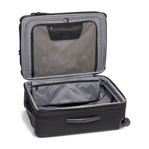 Black Tumi Alpha Short Trip expandable 4-wheeled packing case with black hardware, designed for travel and easy maneuverability.