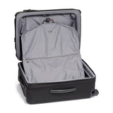 Black Tumi Alpha Short Trip expandable 4-wheeled packing case with black hardware, designed for convenient travel storage.
