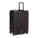 Black Tumi Alpha Short Trip expandable 4-wheeled packing case with black hardware, designed for travel convenience and durability.