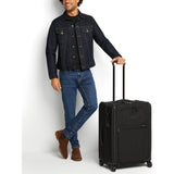 Black Tumi Alpha Short Trip expandable 4-wheeled packing case with black hardware, designed for travel and durability.