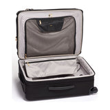 Black Tumi Alpha Short Trip expandable 4-wheeled packing case with black hardware, designed for travel and easy maneuverability.