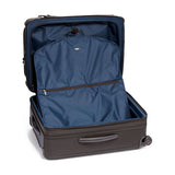 Black Tumi Alpha Short Trip expandable 4-wheeled packing case with black hardware and sleek design for travel.