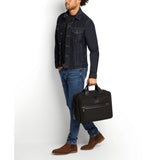 Tumi Organizer Briefcase with multiple compartments and sleek black design for professional carrying and organization.