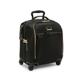 Black Tumi Voyageur Leger compact carry-on luggage with gold accents, lightweight design, and durable wheels for travel.