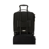 Black Tumi Voyageur Leger Compact Carry-On luggage with gold accents, lightweight design, and sturdy wheels for travel.