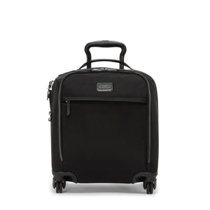 Black Tumi Voyageur lightweight compact carry-on luggage with gold accents, durable design, and smooth rolling wheels.