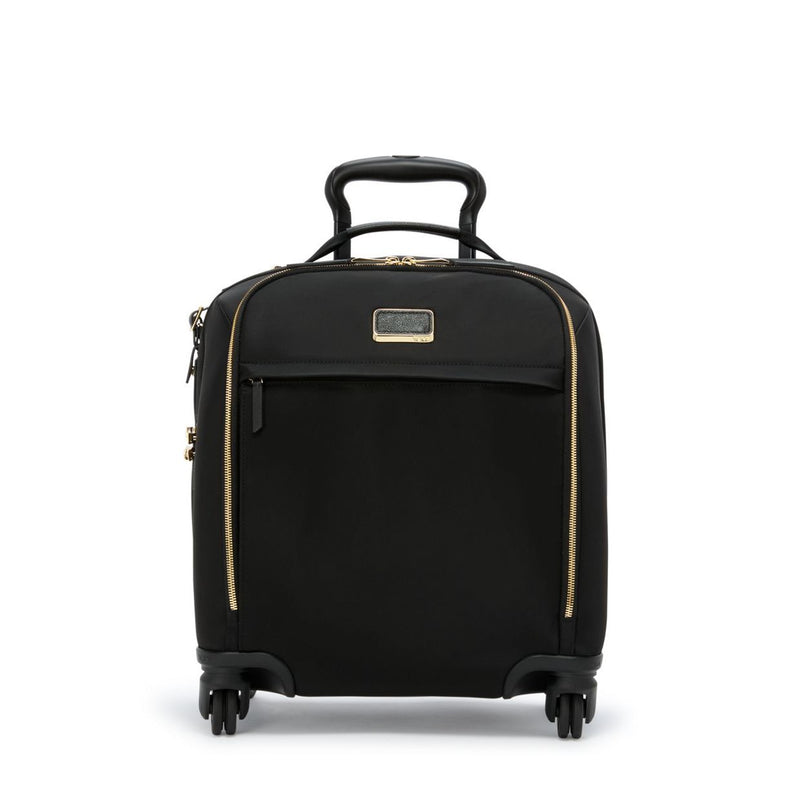 Black Tumi Voyageur lightweight compact carry-on luggage with gold accents, featuring smooth wheels and a sturdy handle.