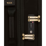 Black Tumi Voyageur Leger international carry-on luggage with gold accents, lightweight design, and durable hard shell exterior.