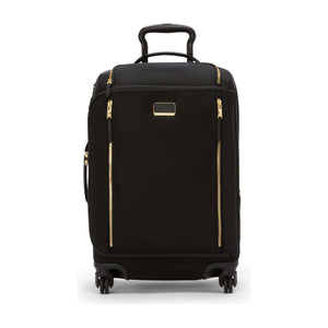 Black Tumi Voyageur Leger international carry-on luggage with gold accents, lightweight design, and durable wheels for travel.