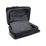 Navy Tumi 19 Degree polycarbonate international carry-on luggage with four spinner wheels and TSA lock for travel.