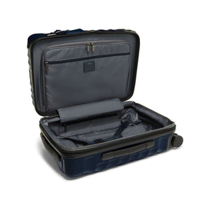 Navy Tumi 19 Degree polycarbonate international carry-on luggage with four spinner wheels and telescoping handle.