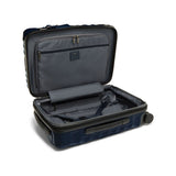 Navy Tumi 19 Degree polycarbonate international carry-on luggage with four spinner wheels and telescoping handle.