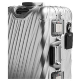 Tumi 19 Degree aluminum international carry-on luggage with sleek hard-shell design and four spinner wheels.