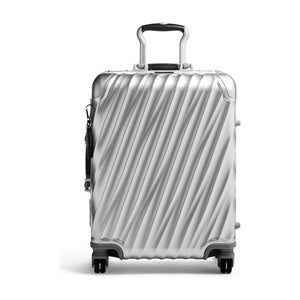 Silver Tumi 19 Degree aluminum international carry-on luggage with sleek hard shell and telescoping handle.
