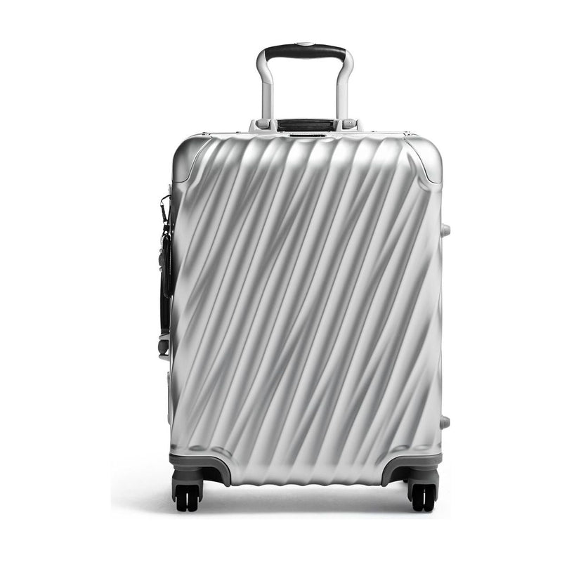 Tumi 19 Degree aluminum international carry-on luggage with sleek hard shell and telescoping handle.