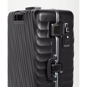 Black Tumi 19 Degree Frame checked luggage with textured surface for extended trips, durable and spacious travel suitcase.