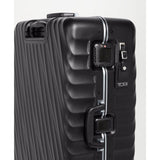 Black Tumi 19 Degree Frame checked luggage with textured surface for extended trips, durable and spacious travel suitcase.