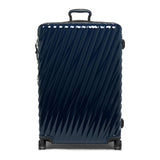 Navy Tumi 19 Degree polycarbonate checked luggage with extended handle and wheels, designed for extended trips.