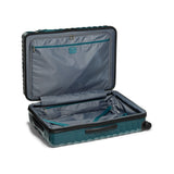 Navy Tumi 19 Degree polycarbonate checked luggage with extended handle and four spinner wheels for travel durability.