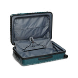 Navy Tumi 19 Degree polycarbonate checked luggage with extended handles and four spinner wheels for easy travel.