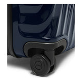 Navy Tumi 19 Degree polycarbonate checked luggage for short trips with four spinner wheels and a telescoping handle.