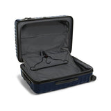 Navy Tumi 19 Degree Polycarbonate checked luggage for short trips, featuring a hard shell and rolling wheels.