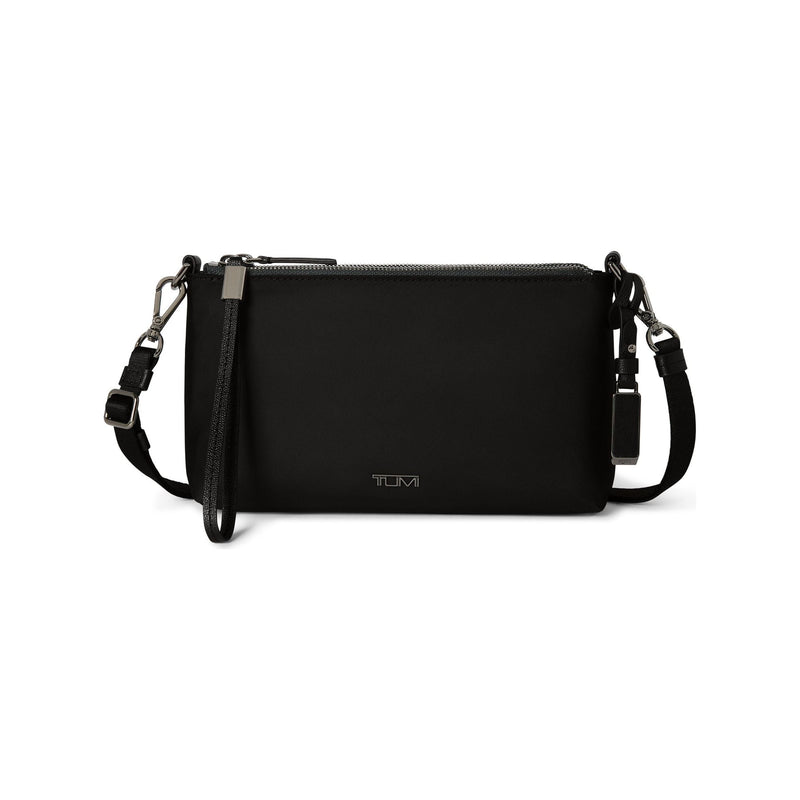 Black Tumi Voyageur Adela crossbody bag with gunmetal accents, featuring sleek design and adjustable strap.