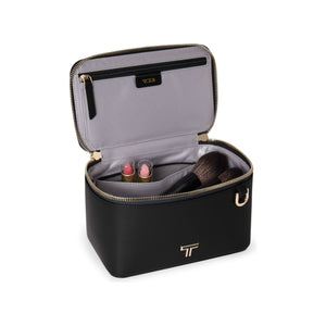 Black Tumi Voyageur Lex Small Train Case Crossbody Bag with gold accents, compact and stylish for travel and everyday use.