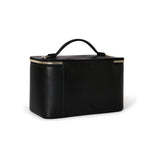 Black Tumi Voyageur Lex Train Case Crossbody bag with gold hardware, compact travel accessory, and adjustable strap.