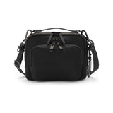 Black Tumi Voyageur Teghan crossbody bag with gold accents, featuring a sleek design and adjustable strap for everyday carry.